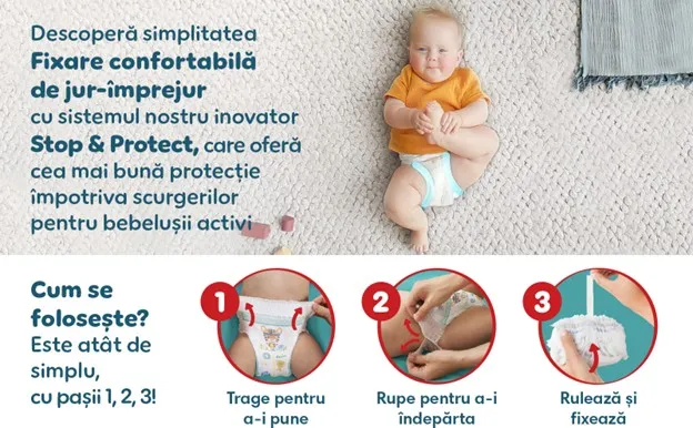bebelus intins pe covor imbracat cu pampers bebelus intins pe covor imbracat cu pampers