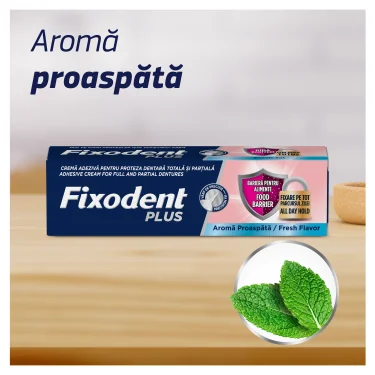 Cutie de Fixodent crema adeziva pentru proteza dentara, varianta Complete, aroma proaspata, langa frunze de menta. Cutie de Fixodent crema adeziva pentru proteza dentara, varianta Complete, aroma proaspata, langa frunze de menta.
